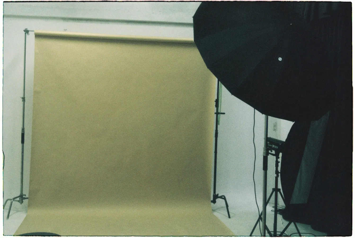 Neutral photo studio with a backdrop and studio lights